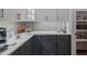 Modern kitchen with white and gray cabinets at 62 Teal Trace Ct, Pittsboro, NC 27312