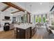 Open kitchen with large island and stainless steel appliances at 62 Teal Trace Ct, Pittsboro, NC 27312