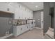 Modern laundry room with white cabinets and high-efficiency washer and dryer at 62 Teal Trace Ct, Pittsboro, NC 27312