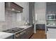 Modern kitchen with gray cabinetry and a gas cooktop at 62 Teal Trace Ct, Pittsboro, NC 27312