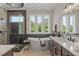 Luxurious bathroom with soaking tub, walk-in shower, and modern vanity at 62 Teal Trace Ct, Pittsboro, NC 27312