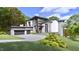 Modern two-story home with attached garage and landscaped yard at 114 Mountaintop Cir, Pittsboro, NC 27312