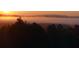 Sunrise over a tranquil landscape with fog in the valley at 114 Mountaintop Cir, Pittsboro, NC 27312