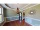 Formal dining room with hardwood floors and chandelier at 104 Abbeville Ln, Holly Springs, NC 27540