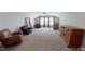 Spacious bonus room with large windows and plenty of natural light at 104 Abbeville Ln, Holly Springs, NC 27540