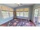 Bright sunroom with multiple windows, providing ample natural light at 104 Abbeville Ln, Holly Springs, NC 27540