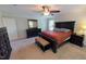 Spacious Primary bedroom with carpeted floors and large windows at 104 Abbeville Ln, Holly Springs, NC 27540