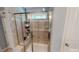 Large walk-in shower with tiled walls and a built-in seat at 104 Abbeville Ln, Holly Springs, NC 27540
