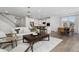 Spacious living room with hardwood floors, and open to kitchen and dining area at 449 Winding Creek Dr, Lillington, NC 27546
