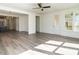 Living area with hardwood floors, access to patio, and abundant natural light at 1717 Grassy Falls Ln, Wendell, NC 27591