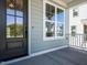 Dark brown front door and white window trim at 1717 Grassy Falls Ln, Wendell, NC 27591
