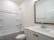 Clean bathroom with white vanity and a bathtub at 1717 Grassy Falls Ln, Wendell, NC 27591