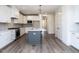 Modern kitchen with stainless steel appliances and a large island at 1717 Grassy Falls Ln, Wendell, NC 27591