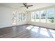 Bright living room with hardwood floors and sliding glass doors to patio at 1717 Grassy Falls Ln, Wendell, NC 27591