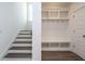 Staircase with dark hardwood treads and white risers at 1717 Grassy Falls Ln, Wendell, NC 27591