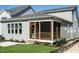 Home exterior showcasing a screened porch and landscaping at 1717 Grassy Falls Ln, Wendell, NC 27591