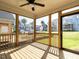 Relaxing screened porch with wood flooring and views of the neighborhood at 1717 Grassy Falls Ln, Wendell, NC 27591