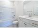Clean bathroom with white vanity, bathtub, and tile flooring at 1717 Grassy Falls Ln, Wendell, NC 27591