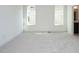 Spacious bedroom with neutral carpeting and two windows at 1717 Grassy Falls Ln, Wendell, NC 27591