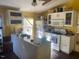 Bright kitchen with white cabinets and an island at 144A Celebrity Dairy Way, Siler City, NC 27344