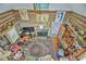 Living room with fireplace, bookshelves, and high ceiling at 144A Celebrity Dairy Way, Siler City, NC 27344