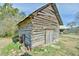 Rustic wooden shed with a wagon wheel at 144A Celebrity Dairy Way, Siler City, NC 27344