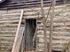 Rustic log cabin exterior with aged wood and a door at 144A Celebrity Dairy Way, Siler City, NC 27344
