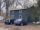 Gray multi-Gathering home with parking and mature trees at 144A Celebrity Dairy Way, Siler City, NC 27344
