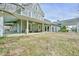 Gray house with a large wrap-around porch, showcasing details at 144A Celebrity Dairy Way, Siler City, NC 27344