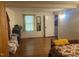 Simple bedroom with wooden floors and a bed at 144A Celebrity Dairy Way, Siler City, NC 27344