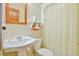 Simple bathroom with shower/tub combo, toilet, and pedestal sink at 144A Celebrity Dairy Way, Siler City, NC 27344