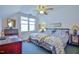 Bedroom with two twin beds, ceiling fan, and window at 144A Celebrity Dairy Way, Siler City, NC 27344