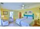 Bright bedroom with two twin beds, ceiling fan, and ample natural light at 144A Celebrity Dairy Way, Siler City, NC 27344
