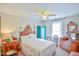 Bedroom with queen bed, ceiling fan, and antique dresser at 144A Celebrity Dairy Way, Siler City, NC 27344