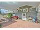 Brick patio with covered seating area, outdoor heaters, and table at 144A Celebrity Dairy Way, Siler City, NC 27344