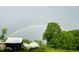 Scenic farm view with rainbow, barns, and lush greenery at 144A Celebrity Dairy Way, Siler City, NC 27344