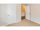 Bedroom with carpet, white doors and access to another room at 122 Vega Loop # 61, Sanford, NC 27330