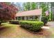 Ranch style home with a covered porch and American flag at 2723 New Sharon Church Rd, Hillsborough, NC 27278