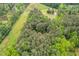Aerial view of wooded lot with small house at 2723 New Sharon Church Rd, Hillsborough, NC 27278