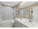 Shared bathroom with double vanity and bathtub at 8912 Stratus St, Willow Springs, NC 27592