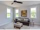 Relaxing sitting room with comfortable couch and ottoman at 85 Harvest View Way, Franklinton, NC 27525