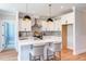 Modern kitchen with white cabinets and island at 85 Harvest View Way, Franklinton, NC 27525