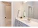 Clean bathroom with white subway tile and grey vanity at 85 Harvest View Way, Franklinton, NC 27525