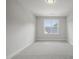 Bright bedroom featuring a large window and neutral wall tones at 85 Harvest View Way, Franklinton, NC 27525