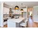 Modern kitchen with white cabinets, quartz countertops, and island at 85 Harvest View Way, Franklinton, NC 27525