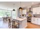 Modern kitchen with white cabinets and island at 85 Harvest View Way, Franklinton, NC 27525