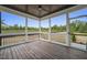 Relaxing screened porch with wood flooring and view of backyard at 85 Harvest View Way, Franklinton, NC 27525