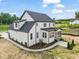 Aerial view of two-story home showcasing backyard and landscaping at 85 Harvest View Way, Franklinton, NC 27525
