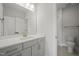 Bathroom with grey vanity, white quartz countertop, and shower at 85 Harvest View Way, Franklinton, NC 27525