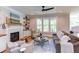 Living room with fireplace and large windows at 85 Harvest View Way, Franklinton, NC 27525
